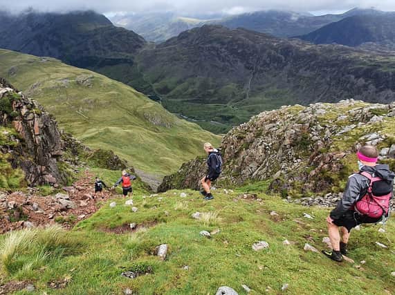 Harrogate Harriers fell runner Helen Price descending a gulley in the Lake District during the Joss Naylor Challenge. (Picture by Simon Franklin)