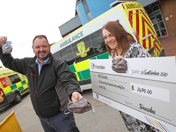 Colourful success - Transdev CEO Alex Hornby presents a cheque for £2,475 to Harrogate District Hospital’s Community and Events Fundraiser Georgia Hudson, representing NHS Charities Together.