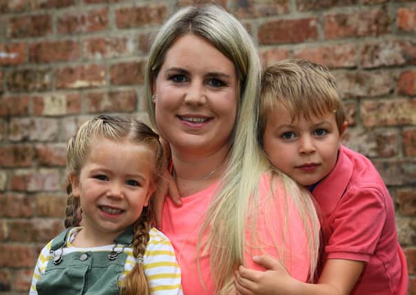 Jess Cooper, whose husband Paul died in a road accident near Harrogate in 2018 and is keen to raise awareness of organ donation, after she donated his organs.Pictured with her children Archie (7) and Emilia (3).8th September 2020.Picture : Jonathan Gawthorpe