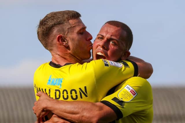 Jack Muldoon, left, and Aaron Martin enjoy Town's victory at Roots Hall.