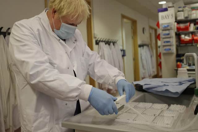 Prime Minister Boris Johnson during a visit to the Jenner Institute in Oxford, where toured the laboratory and met scientists who are leading the COVID vaccine research. Photo: PA