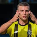 Jack Muldoon celebrates after opening the scoring for Harrogate Town as they beat Southend United in their first-ever League Two outing. Pictures: Matt Kirkham