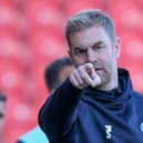 Pointing the way: Harrogate Town manager Simon Weaver watches on during his side's 2-2 draw with Walsall at the Keepmoat Stadium. Pictures: Matt Kirkham