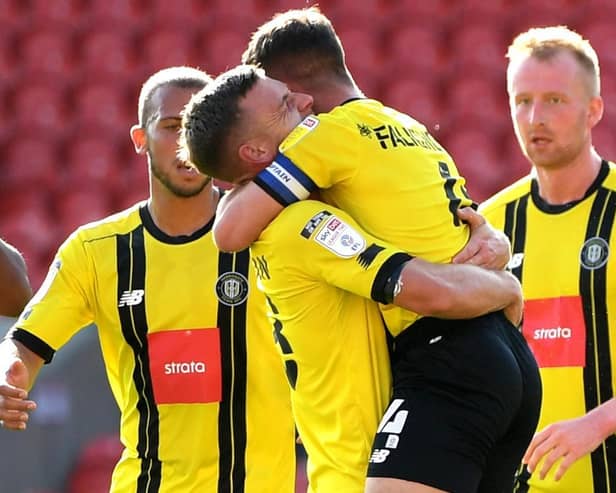 Harrogate Town celebrate taking a 2-1 lead against Walsall. Pictures: Getty Images