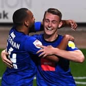Will Smith, right, is congratulated by Brendan Kiernan after heading Harrogate Town into a 1-0 lead against Notts County. Pictures: Getty Images