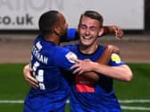 Will Smith, right, is congratulated by Brendan Kiernan after heading Harrogate Town into a 1-0 lead against Notts County. Pictures: Getty Images