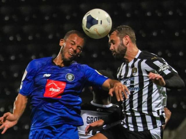 Aaron Martin wins a header during Harrogate Town's FA Trophy semi-final triumph over Notts County. Pictures: Matt Kirkham