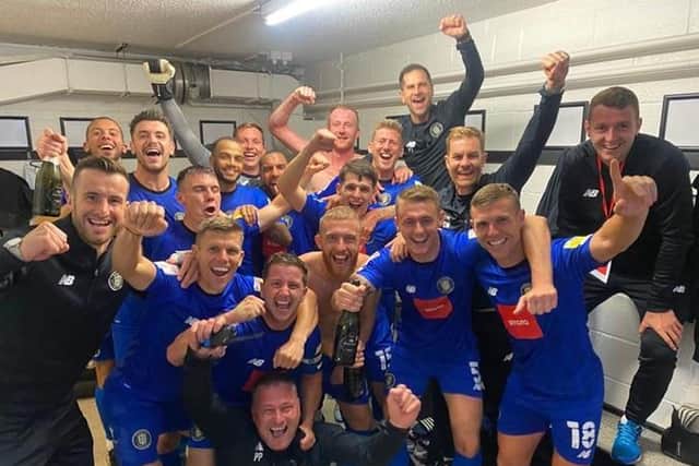 Harrogate Town enjoy Tuesday's FA Trophy semi-final success over Notts County in the Meadow Lane changing rooms.
