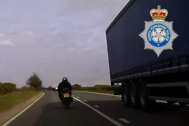 This screen grab from the North Yorkshire Police dashcam footage shows Hindson speeding away from officers along the A59 towards the A1(M).
