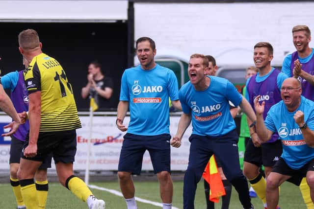 Joe Leesley celebrates with Simon Weaver and the Harrogate Town dug-out after netting a screamer against Solihull Moors on the opening day of the 2019/20 season.