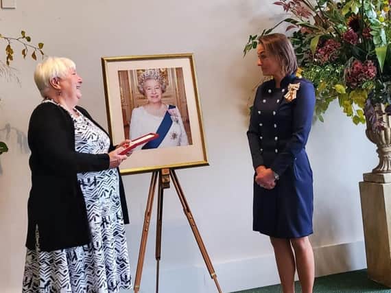 Harrogate's Christine Stewart receiving her British Empire Medal from Johanna Ropner, Lord Lieutenant of North Yorkshire.