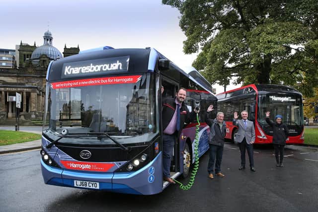 Harrogate Bus Company CEO Alex Hornby (left) with a new zero emission electric bus which is being trialled in service on its busy route 1 between Harrogate and Knaresborough, along with President of Knaresborough Chamber of Commerce President Steve Teggin; Harrogate Borough Councils Cabinet Member for Carbon Reduction Coun. Phil Ireland; and Harrogate Business Improvement Districts Harrogate Host Jo Caswell.