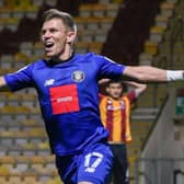 Lloyd Kerry celebrates after netting the only goal of the game in Harrogate Town's victory over Bradford City. Picture: Matt Kirkham