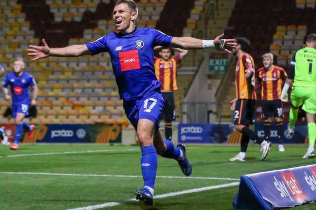 Lloyd Kerry celebrates after converting Jack Muldoon's right-wing cross to break the deadlock at Valley Parade. Picture: Matt Kirkham