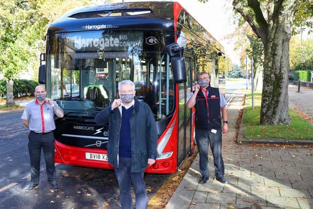 Harrogate and Knaresborough MP Andrew Jones (centre) joins staff from The Harrogate Bus Company to remind customers that unless they are legally exempt, wearing a face covering is mandatory on all bus journeys