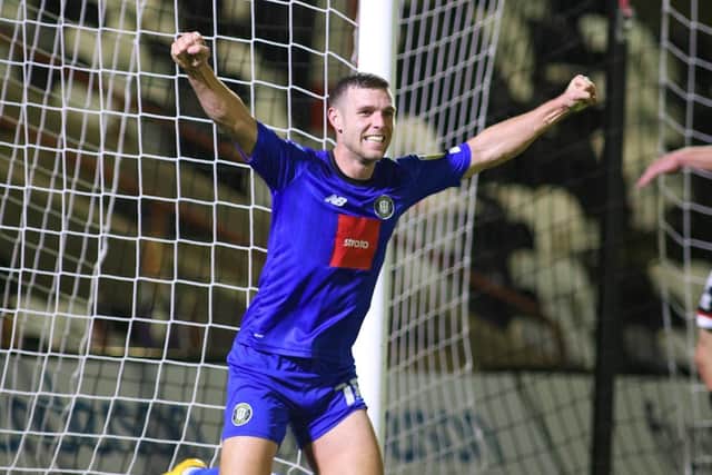 Jack Muldoon celebrates after scoring his second goal of the evening at Blundell Park.