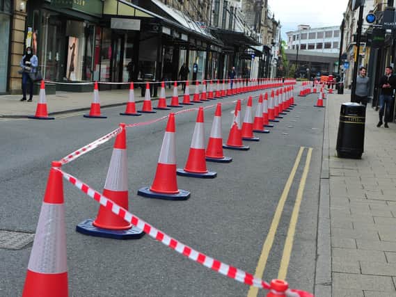 These traffic cones on James Street in Harrogate - and others on Albert Street - will be replaced with planters.
