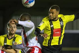 Warren Burrell wins a header during Harrogate Town's League Two clash with Stevenage. Pictures: Matt Kirkham