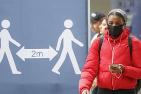 A social distancing sign in Leeds city centre, West Yorkshire, where tougher lockdown measures will be introduced locally after a rise in coronavirus infections. Photo: PA