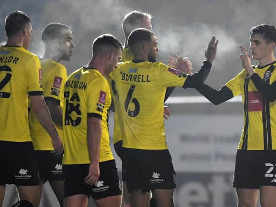 Harrogate Town celebrate going 2-0 up during their FA Cup first round win over Skelmersdale United at the EnviroVent Stadium. Pictures: Getty Images