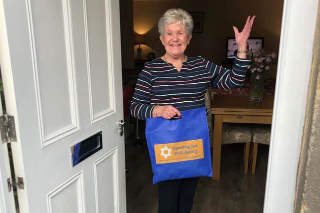 Anne Cliff, who joined Dancing for Well-Being a few years ago, is delighted to receive a prop bag to keep on dancing.