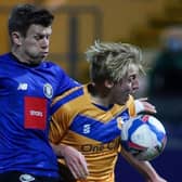 Lloyd Kerry gets stuck in during Harrogate Town's midweek win at Mansfield Town. Pictures: Matt Kirkham