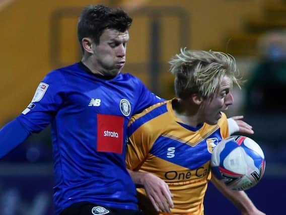 Lloyd Kerry gets stuck in during Harrogate Town's midweek win at Mansfield Town. Pictures: Matt Kirkham