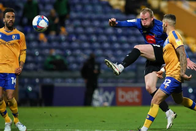 Town number nine Mark Beck lets fly at goal.