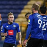 Harrogate Town players celebrate Calvin Miller's goal at Mansfield. Pictures: Matt Kirkham