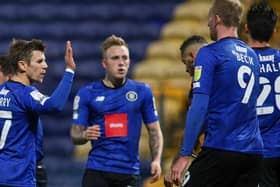 Harrogate Town players celebrate Calvin Miller's goal at Mansfield. Pictures: Matt Kirkham