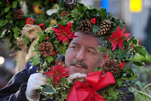 Horticap student Timothy Simpson working on the Christmas wreaths. Picture: Gerard Binks.