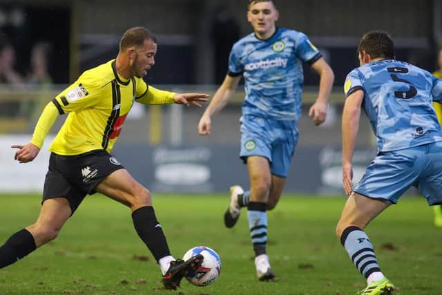 Aaron Martin looks for a way through the Forest Green defence.