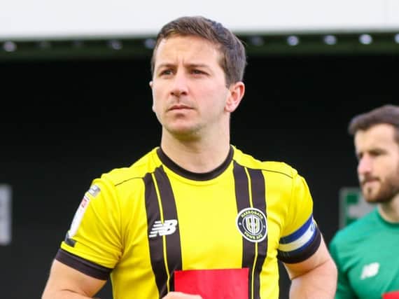 Harrogate Town captain Josh Falkingham leads his side out at the EnviroVent Stadium for Saturday's League Two clash with Forest Green Rovers. Pictures: Matt Kirkham