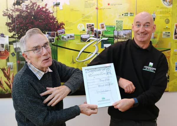 John Richardson (left), chairman of horticultural nursery business Johnsons of Whixley, congratulates Tony Coles on 25 years with the company.