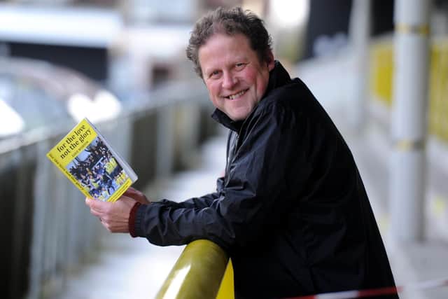 Harrogate town superfan Dave Worton pictured at at the EnviroVent Stadium with his new book 'For The Love Not The Glory'. (Picture: Gerard Binks)