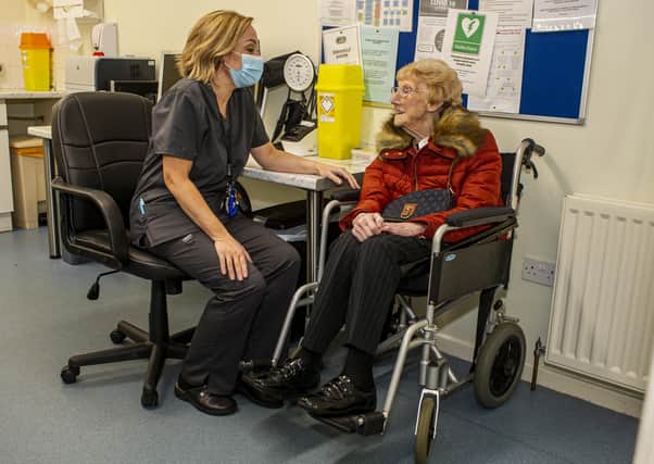 19 December 2020........  103-year-old  Marjorie Patterson,  receives the Covid-19 vaccine at the Grange Medical Centre in Seacroft with Andrea Mann, Clinical Director at Cross Gates Primary Care Network.   Picture Tony Johnson
