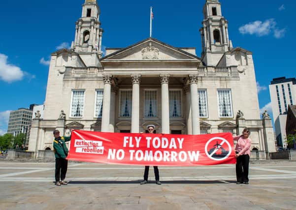 Alistair Chesterman, Christopher Hore and  Drew Long of Extinction Rebellion hold socially distanced protest against expansion of Leeds Bradford Airport outside Leeds Civic Hall. 21 May 2020. Picture Bruce Rollinson