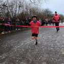 Harry crossing the finish line after his amazing 50km challenge.