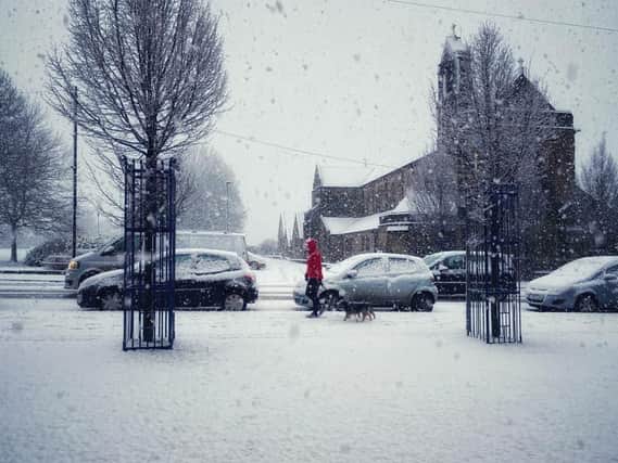 A lone pedestrian braves the snow this morning on Starbeck High Street in Harrogate. (Picture by Stuart Rhodes)