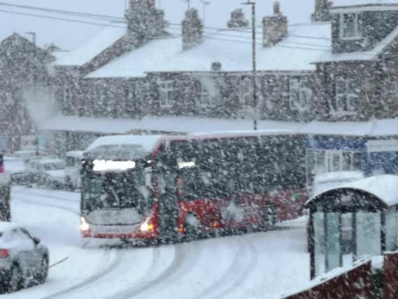 A Harrogate Bus Company bus battles through the snow in Bilton in Harrogate today.