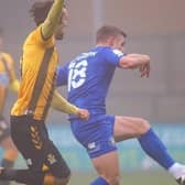 Jack Muldoon fires Harrogate Town into a 10th-minute lead at Cambridge United. Pictures: Matt Kirkham