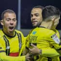 Warren Burrell, centre, congratulates Connor Kirby, right, after Town raced into a first-minute lead against Carlisle United on December 29. Pictures: Matt Kirkham