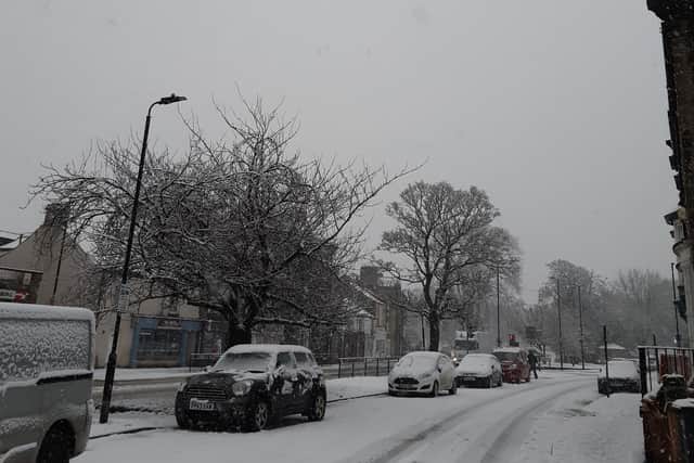 The wintry scene this morning on Skipton Road in Harrogate this morning as heavy snow showers returned to disrupt traffic.