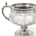 This Edward VII Silver Trophy-Cup by William Aitken of Birmingham, 1905 sold for £9,000.