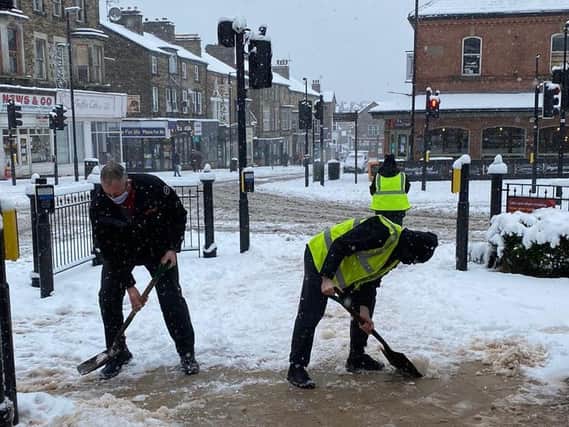 Clearing snow at Harrogate Bus Station.