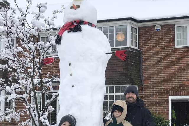How tall? The upper half of the Harrogate family's towering snowman...