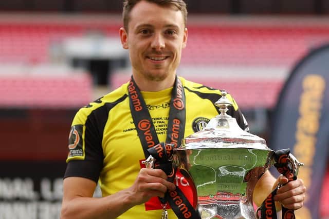 Jack Emmett with the National League play-off final winners' trophy at Wembley Stadium following Town's 3-1 success over Notts County.