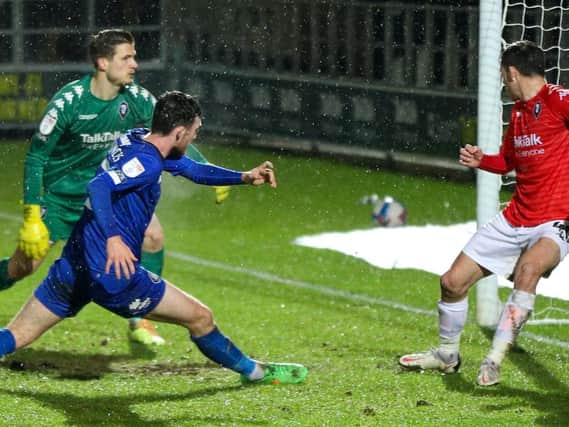 Ed Francis stabs home Harrogate Town's 93rd-minute equaliser at Salford City. Pictures: Matt Kirkham