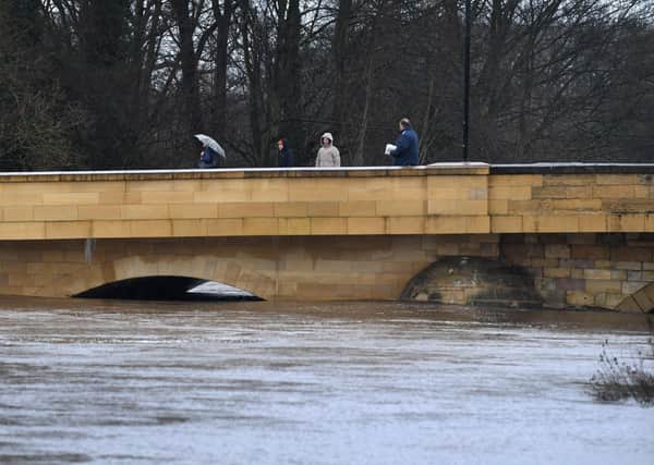People look out at the River Wharfe at Tadcaster, with large amounts of rainfall forcasted in Yorkshire.20th January 2021..Picture by Simon Hulme