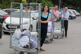 Flashback to 2020 - Fran Taylor from the Harrogate Scubbers with Dan Thirkell and Andrew Forsyth from Harrogate District Hospital with some of the scrubs sewed by the volunteers for staff.